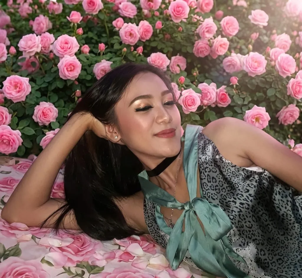 Soft glam makeup in a rose garden