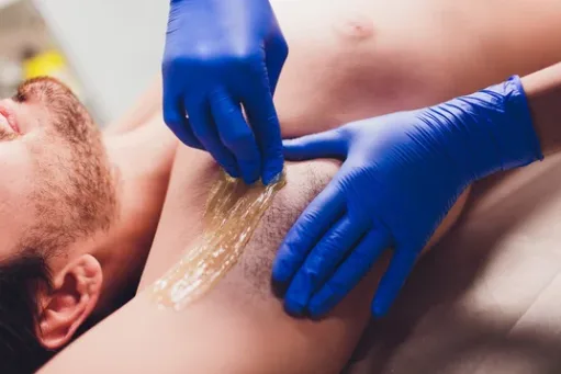 Underarm waxing treatment professional close up
