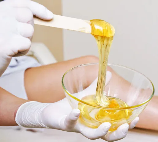 Warm waxing pot and melted wax preparation